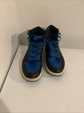 Jordan’s Black and Blue High-Top Sneakers with Blue Laces